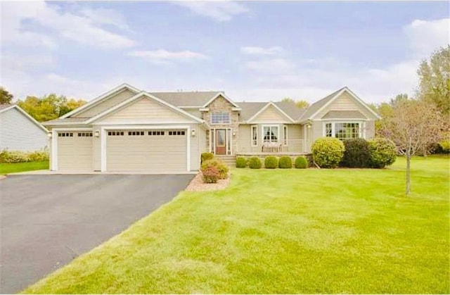 view of front facade with a front lawn and a garage