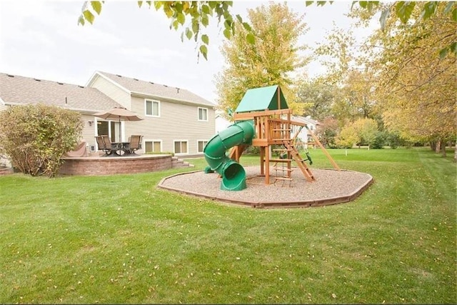 view of play area featuring a yard and a patio