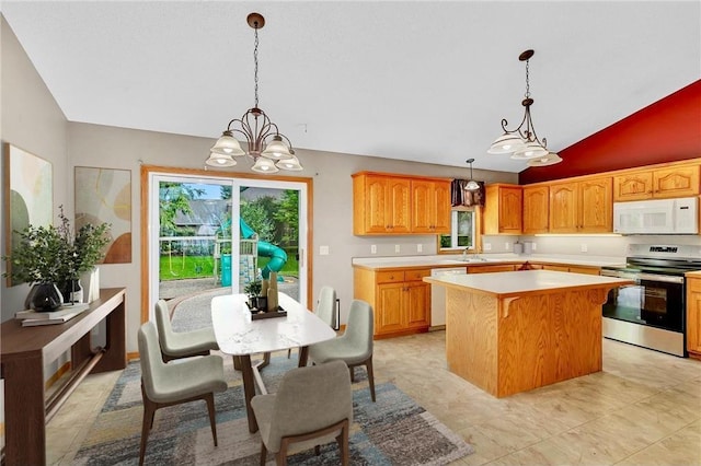 kitchen with a center island, an inviting chandelier, pendant lighting, lofted ceiling, and white appliances