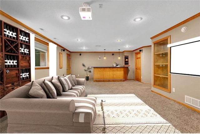 living room with a textured ceiling, ornamental molding, light carpet, and bar area