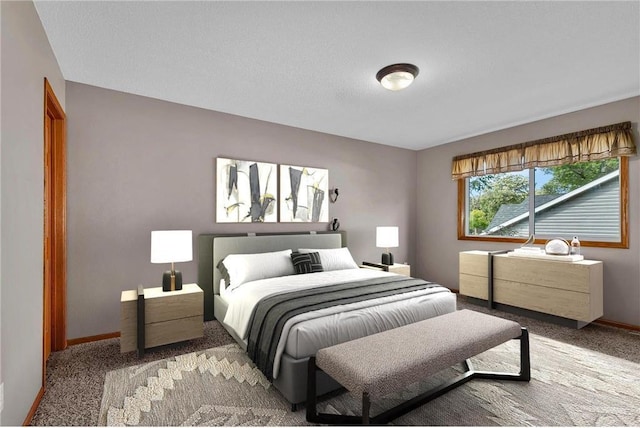 bedroom featuring a textured ceiling and light colored carpet