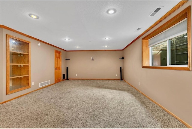 unfurnished room featuring crown molding and carpet floors