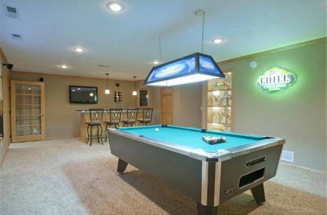 recreation room featuring bar area, light carpet, crown molding, and pool table