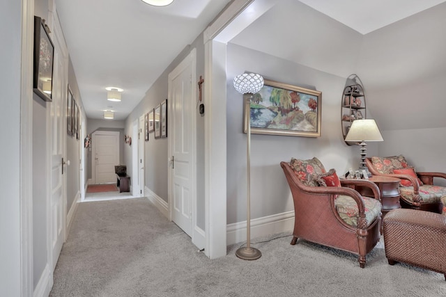 hallway with light colored carpet