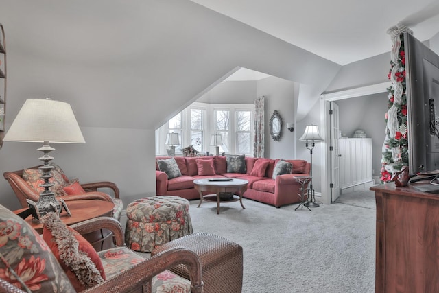 living room with lofted ceiling and light carpet