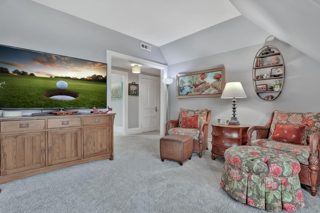 sitting room featuring light carpet and vaulted ceiling