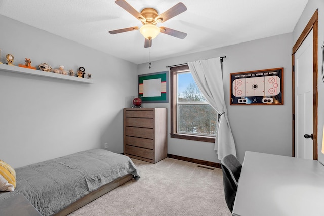 bedroom featuring visible vents, carpet floors, baseboards, and ceiling fan