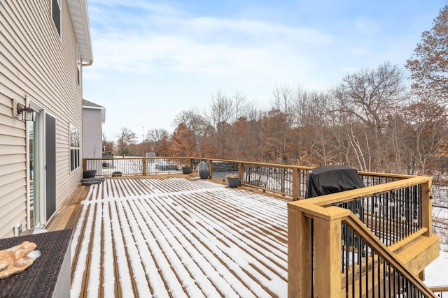 wooden deck featuring area for grilling