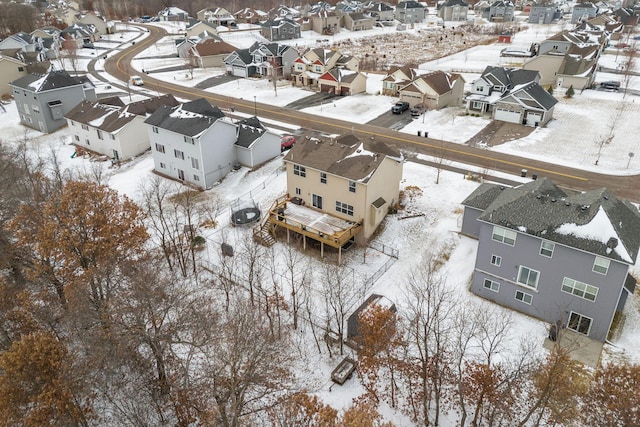 snowy aerial view with a residential view