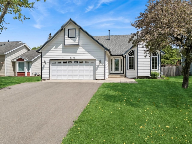 3876 Westbury Ln, Eagan, MN 55123 - view of front facade with a shingled roof, driveway, and an attached garage