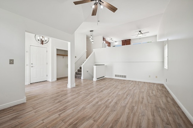3876 Westbury Ln, Eagan, MN 55123 - unfurnished living room featuring ceiling fan, light wood-style flooring, stairs, and baseboards
