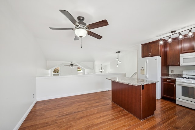 3876 Westbury Ln, Eagan, MN 55123 - kitchen featuring white appliances, ceiling fan, dark wood-style flooring, a center island, and light stone countertops