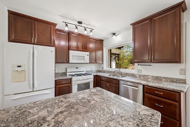 3876 Westbury Ln, Eagan, MN 55123 - kitchen featuring white appliances, a sink, and light stone counters