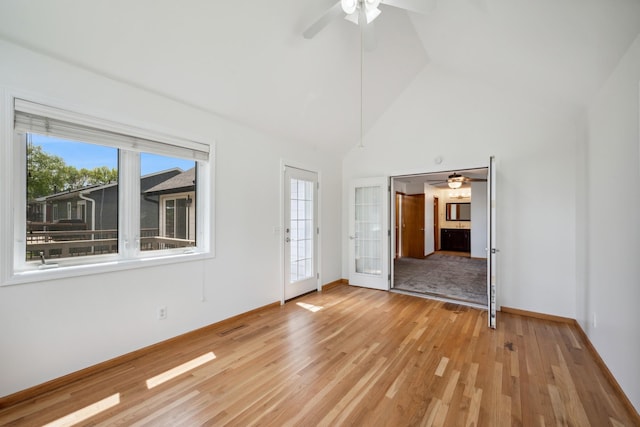 3876 Westbury Ln, Eagan, MN 55123 - unfurnished room featuring ceiling fan, light wood finished floors, high vaulted ceiling, and baseboards
