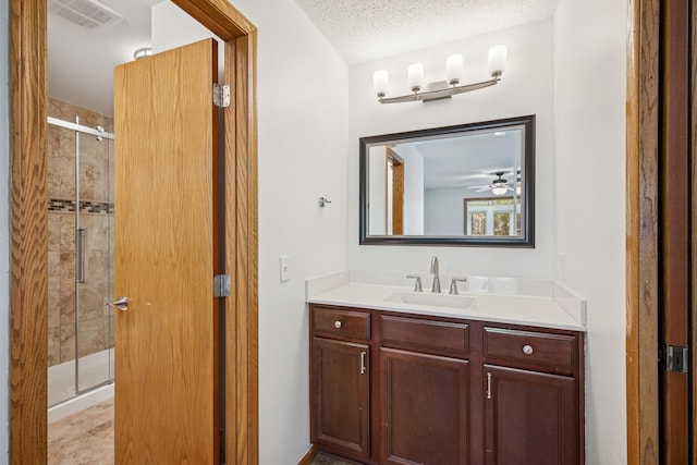 3876 Westbury Ln, Eagan, MN 55123 - bathroom with a shower stall, vanity, and a textured ceiling