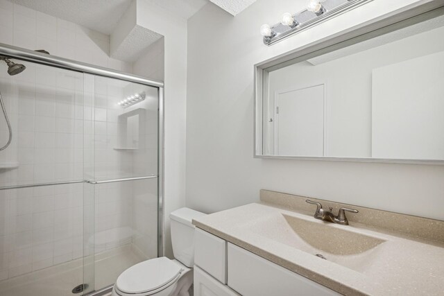 3876 Westbury Ln, Eagan, MN 55123 - bathroom with toilet, a stall shower, and vanity