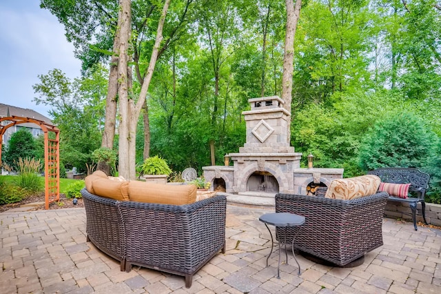 view of patio / terrace featuring an outdoor living space with a fireplace