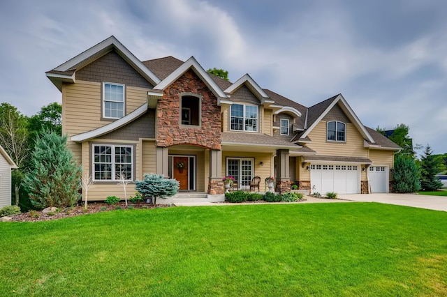 craftsman-style home with a garage and a front lawn