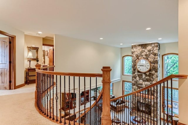 hallway with light colored carpet