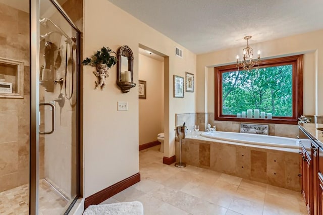 bathroom with a textured ceiling, toilet, independent shower and bath, and a notable chandelier