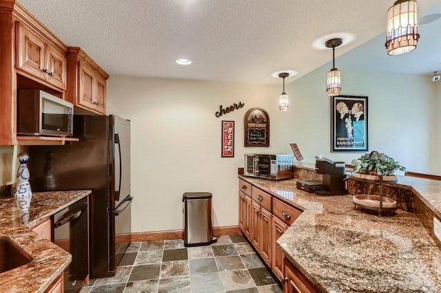 kitchen featuring pendant lighting, black dishwasher, a textured ceiling, and stone countertops