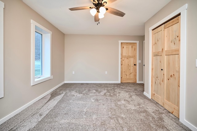 unfurnished bedroom featuring carpet flooring and ceiling fan