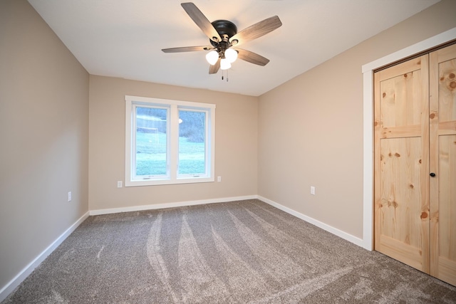 carpeted empty room with ceiling fan