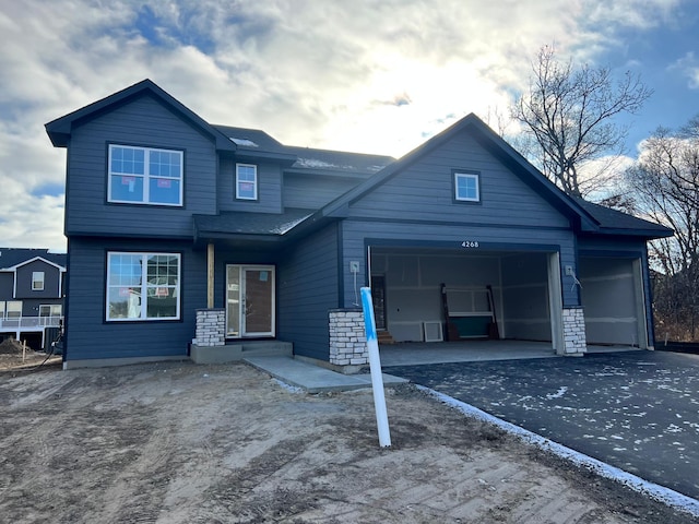 view of front of property featuring a garage