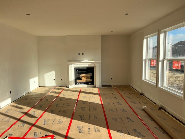 unfurnished living room with plenty of natural light