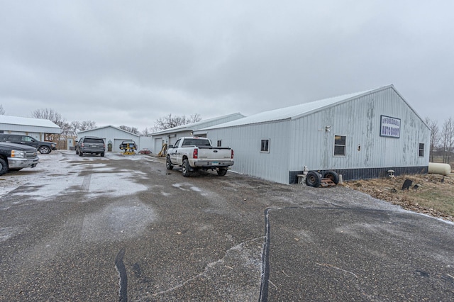 view of side of home featuring an outdoor structure