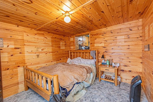 carpeted bedroom featuring wood walls and wooden ceiling