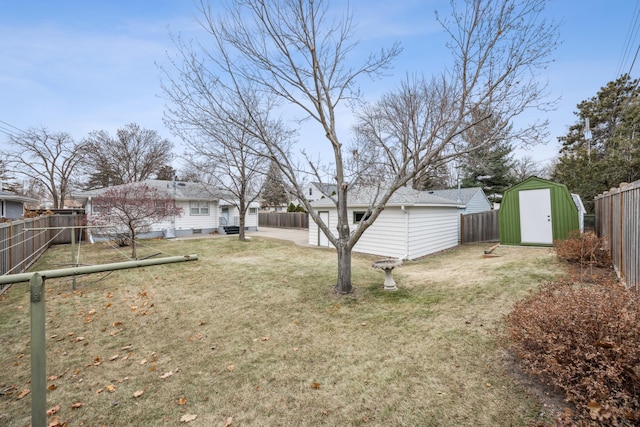 view of yard with a storage unit