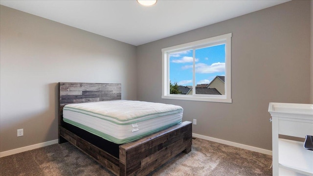 bedroom with dark carpet