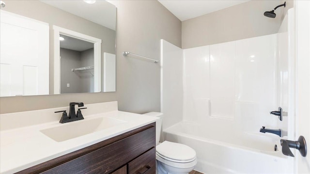 full bathroom with vanity, tub / shower combination, and toilet