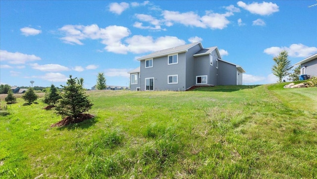 rear view of house with a lawn