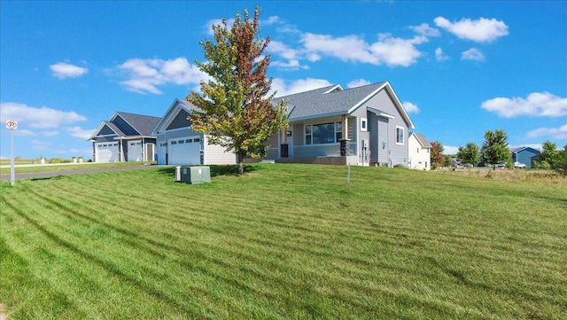 exterior space featuring a lawn and a garage