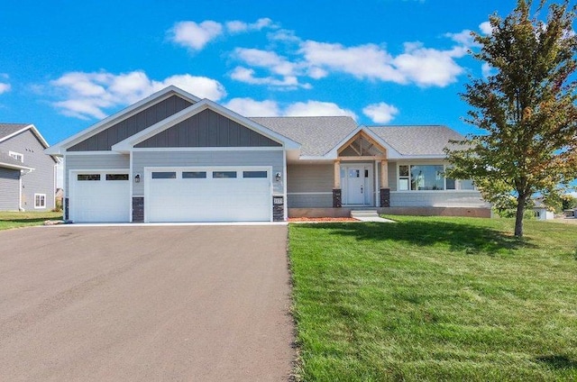 view of front facade featuring a garage and a front lawn