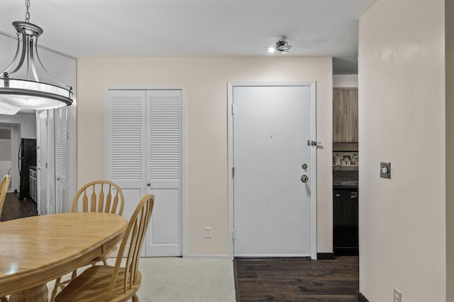 dining room featuring a textured ceiling