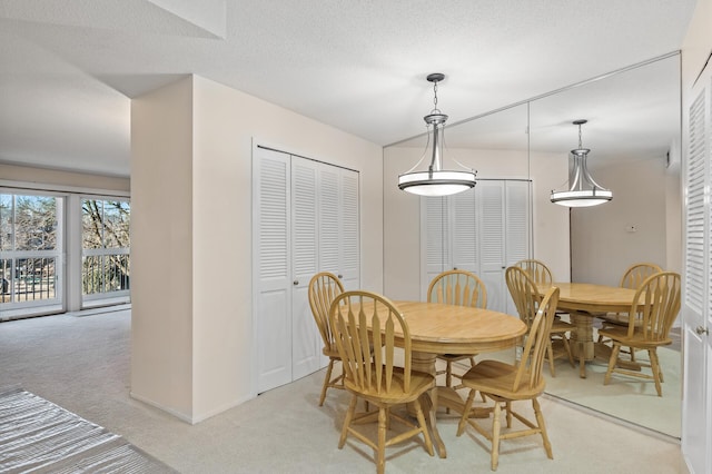 dining area with light colored carpet