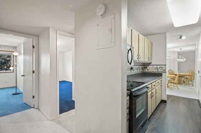 kitchen featuring electric panel, carpet floors, a textured ceiling, and black range with electric cooktop