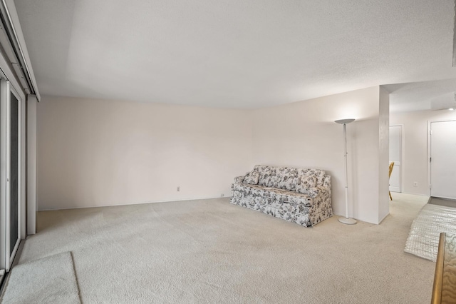 sitting room with light colored carpet