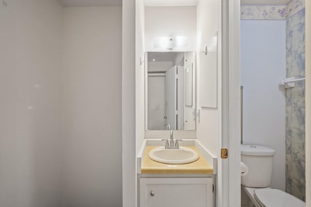 bathroom with vanity and toilet