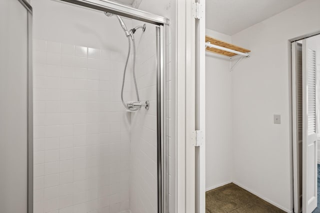 bathroom with a shower with shower door