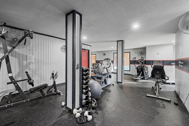 workout area with a textured ceiling