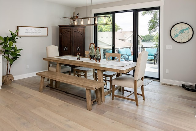 dining space featuring light hardwood / wood-style flooring