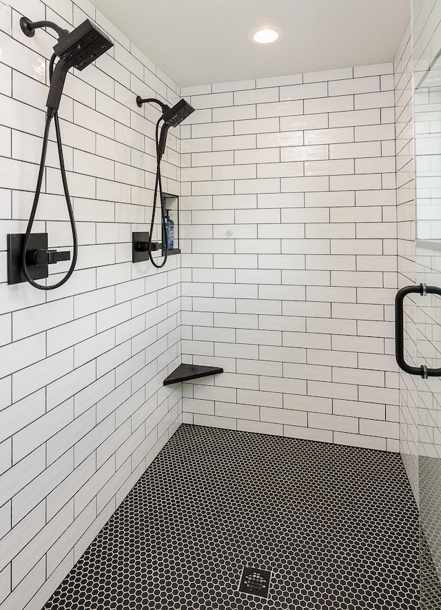 bathroom featuring a shower with shower door