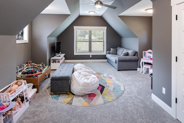 game room featuring ceiling fan, light colored carpet, and lofted ceiling