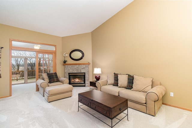 carpeted living room with a fireplace