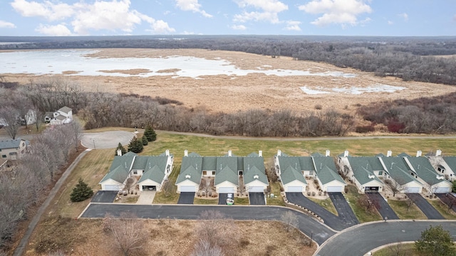 birds eye view of property with a water view