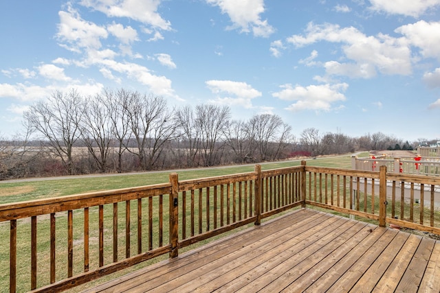 wooden deck with a lawn